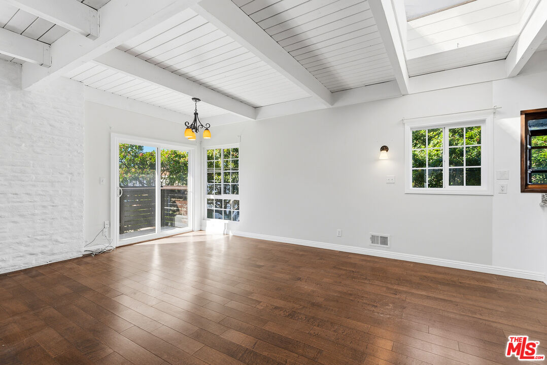 3900 Pacific Avenue Marina del Rey, CA 90292 - Photo 12 of 65 an empty room with wooden floor and windows