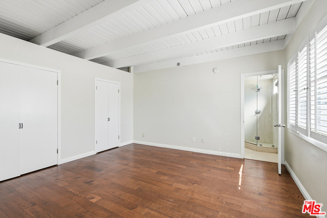 3900 Pacific Avenue Marina del Rey, CA 90292 - Photo 24 of 65 a view of an empty room with wooden floor and a window