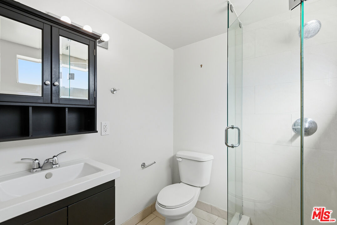 3900 Pacific Avenue Marina del Rey, CA 90292 - Photo 25 of 65 a bathroom with a sink a toilet and shower