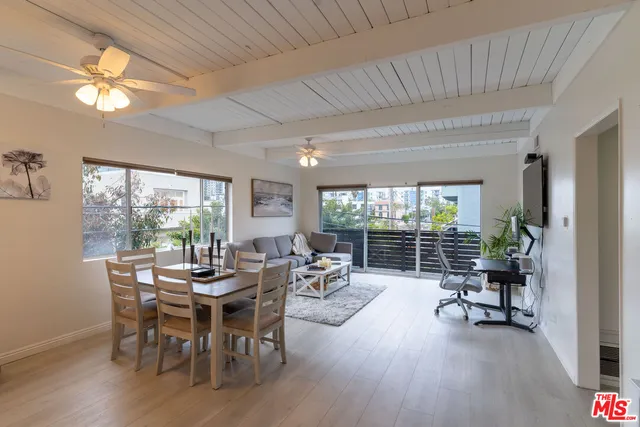 a dining room with furniture window and outside view