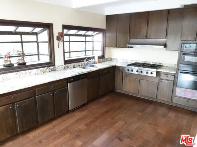 a balcony with wooden floor