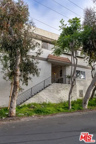 a aerial view of a house with a yard