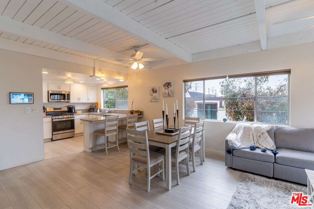 3900 Pacific Avenue Marina del Rey, CA 90292 - Photo 48 of 65 a living room with furniture wooden floor and a large window