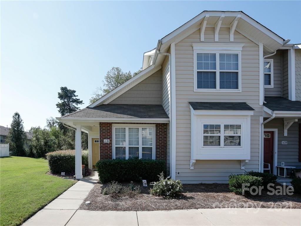 1121 Sienna Sand Way Fort Mill, SC 29708 - Photo 2 of 30 a front view of a house with a yard