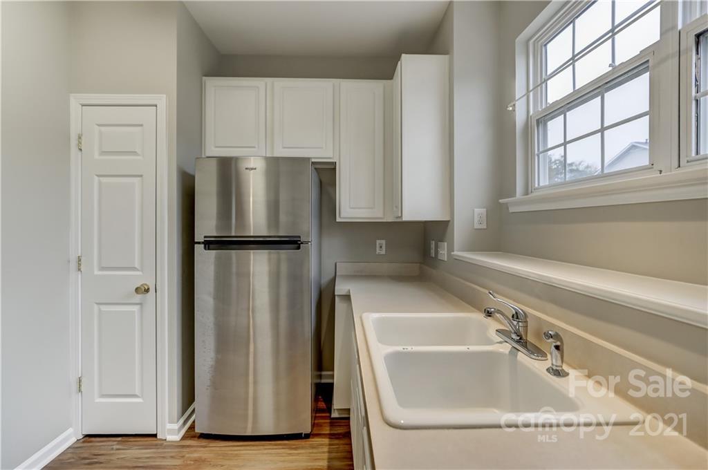 1121 Sienna Sand Way Fort Mill, SC 29708 - Photo 12 of 30 a kitchen with stainless steel appliances granite countertop a refrigerator and a sink