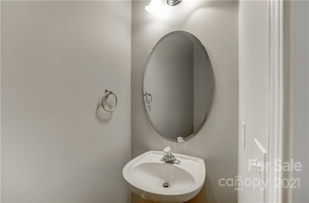 1121 Sienna Sand Way Fort Mill, SC 29708 - Photo 14 of 30 a bathroom with a sink and a mirror