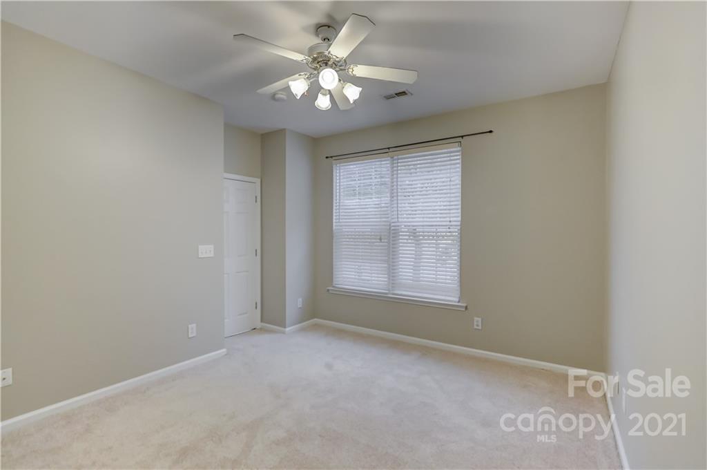 1121 Sienna Sand Way Fort Mill, SC 29708 - Photo 16 of 30 an empty room with windows and fan