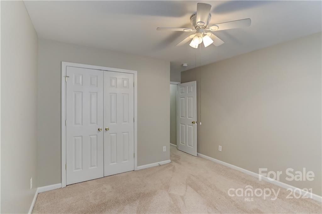 1121 Sienna Sand Way Fort Mill, SC 29708 - Photo 20 of 30 wooden floor in an empty room with a chandelier fan