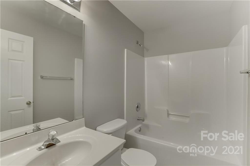 1121 Sienna Sand Way Fort Mill, SC 29708 - Photo 23 of 30 a bathroom with a sink toilet and shower