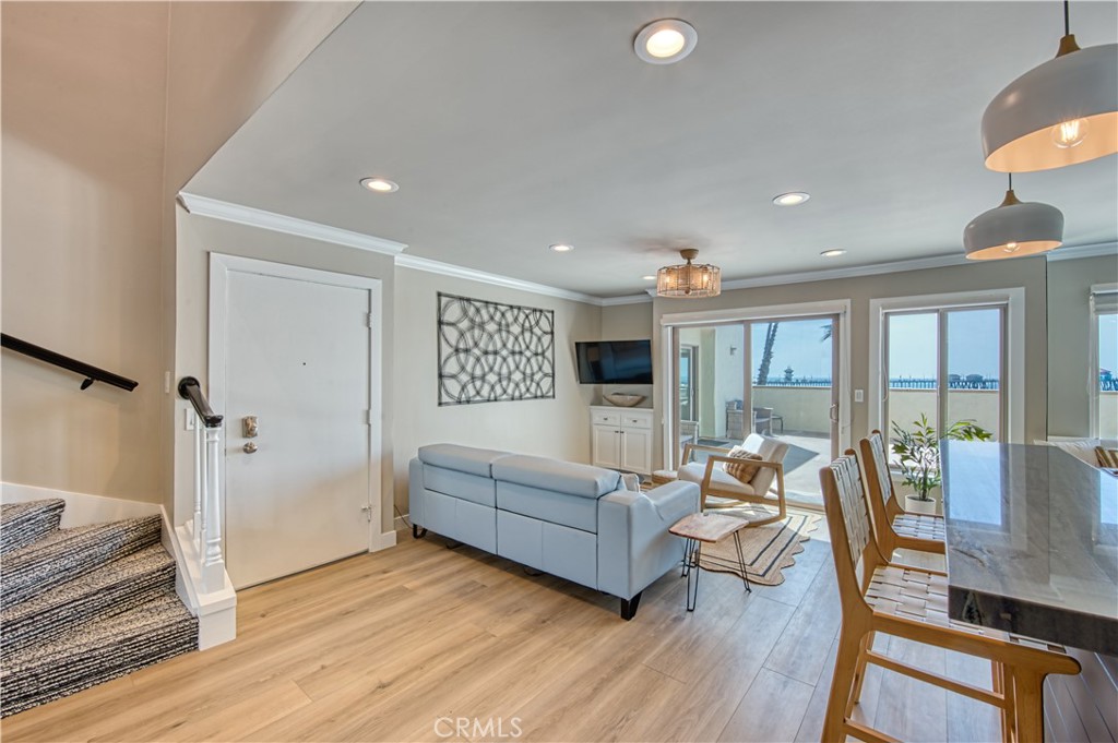 711 Pacific Coast Highway, Unit 421 Huntington Beach, CA 92648 - Photo 7 of 35 a living room with furniture and a large window