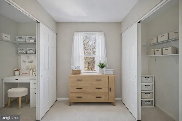 a room with a dresser and a chair