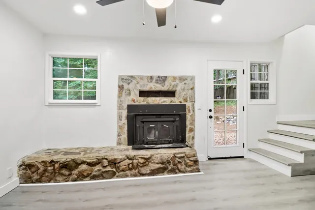 a living room with furniture and a fireplace