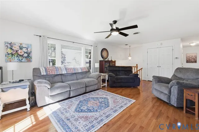 a living room with furniture and a rug