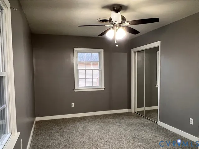 a bedroom with a large bed and a flat screen tv