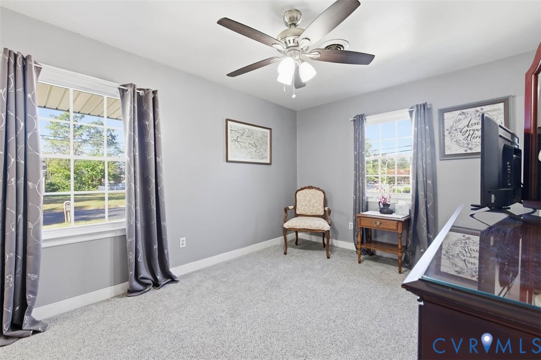 905 Forestview Drive Colonial Heights, VA 23834 - Photo 24 of 48 a living room with furniture two window and a ceiling fan