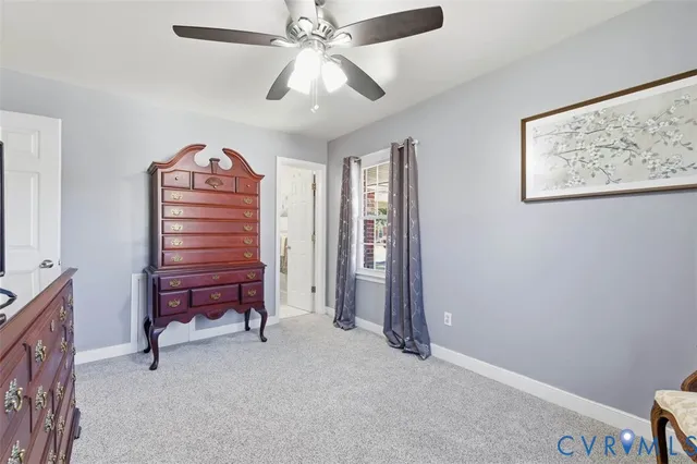 a view of room with stairs and a chandelier fan