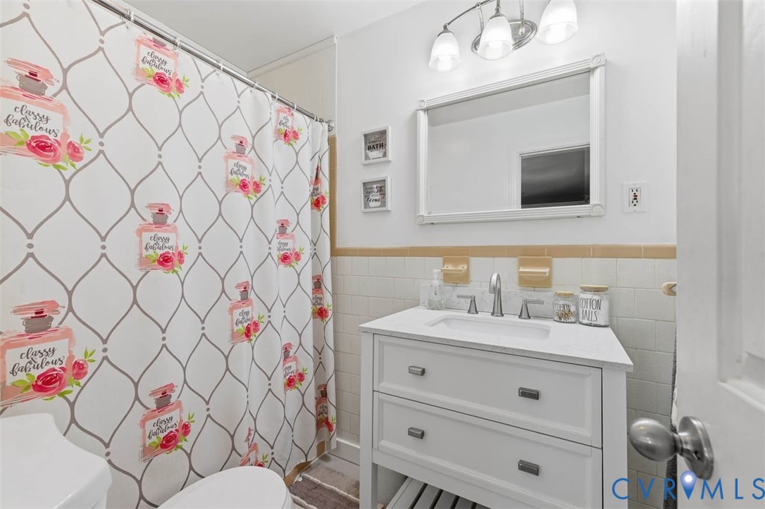 905 Forestview Drive Colonial Heights, VA 23834 - Photo 26 of 48 a bathroom with a sink vanity mirror and toilet
