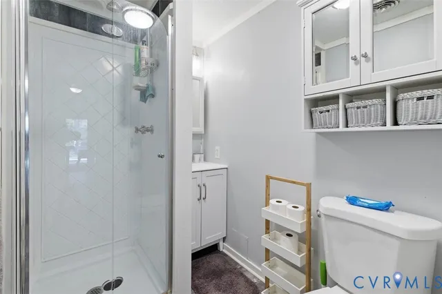 a bathroom with a refrigerator and a sink