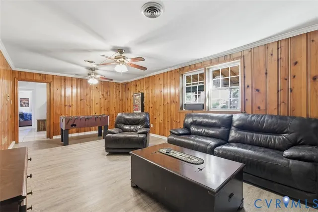 a view of a porch with furniture and a yard