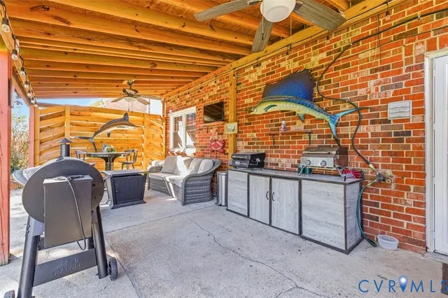 a view of a chair and table in the back yard