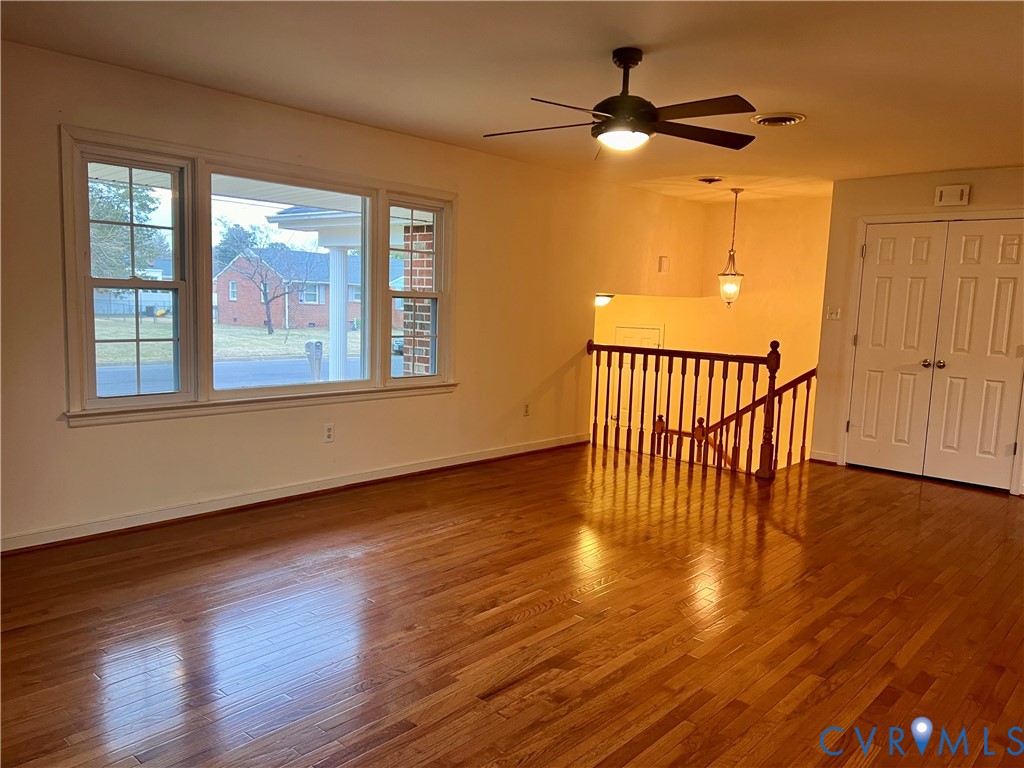 905 Forestview Drive Colonial Heights, VA 23834 - Photo 5 of 48 a view of an empty room with wooden floor and a window