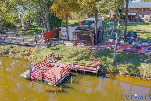 a swimming pool with outdoor seating and yard
