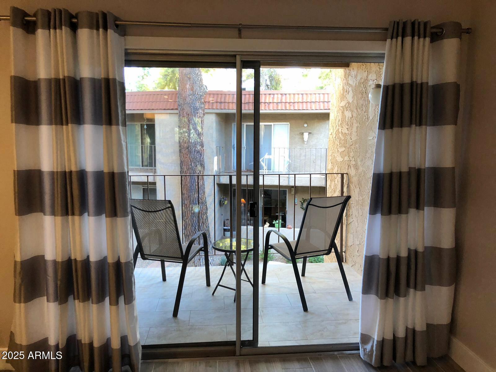 7436 East Chaparral Road, Unit 264B Scottsdale, AZ 85250 - Photo 11 of 22 a view of a dining room with furniture and window