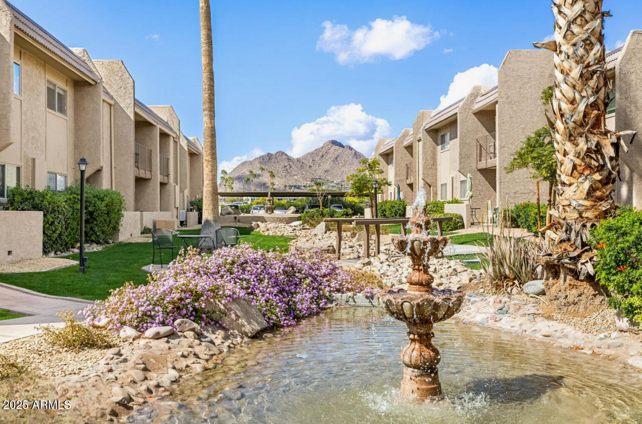 7436 East Chaparral Road, Unit 264B Scottsdale, AZ 85250 - Photo 21 of 22 a front view of a house with a yard