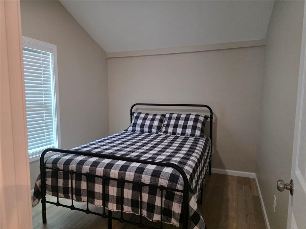 722 Lacy Street Monroe, GA 30655 - Photo 13 of 19 a bedroom with a bed and a window