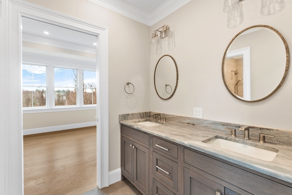 320 Concord Avenue Lexington, MA 02421 - Photo 28 of 40 a bathroom with a granite countertop sink and a mirror