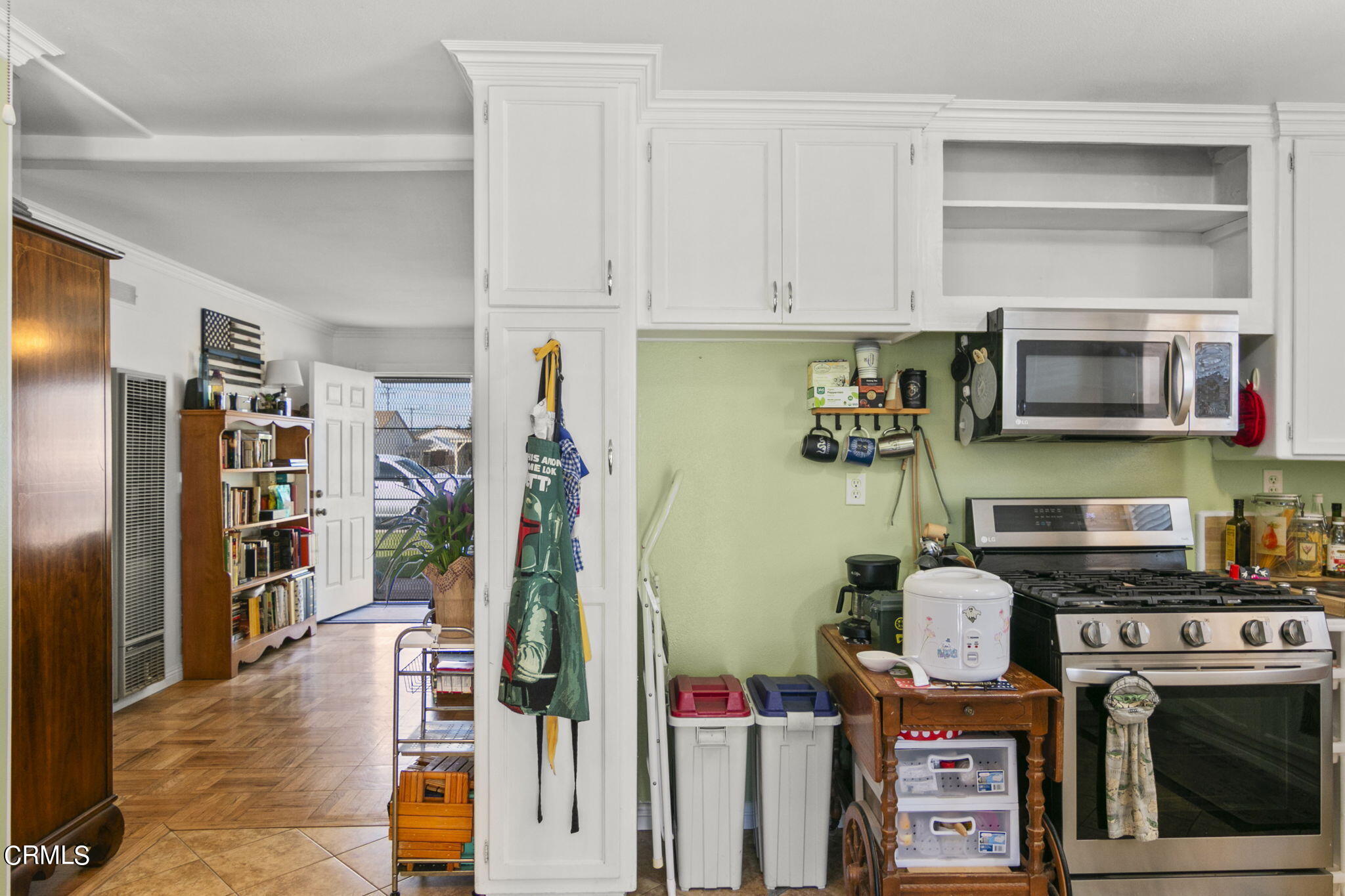 524 Nectarine Street Oxnard, CA 93033 - Photo 12 of 28 a kitchen with stainless steel appliances a stove a refrigerator and cabinets