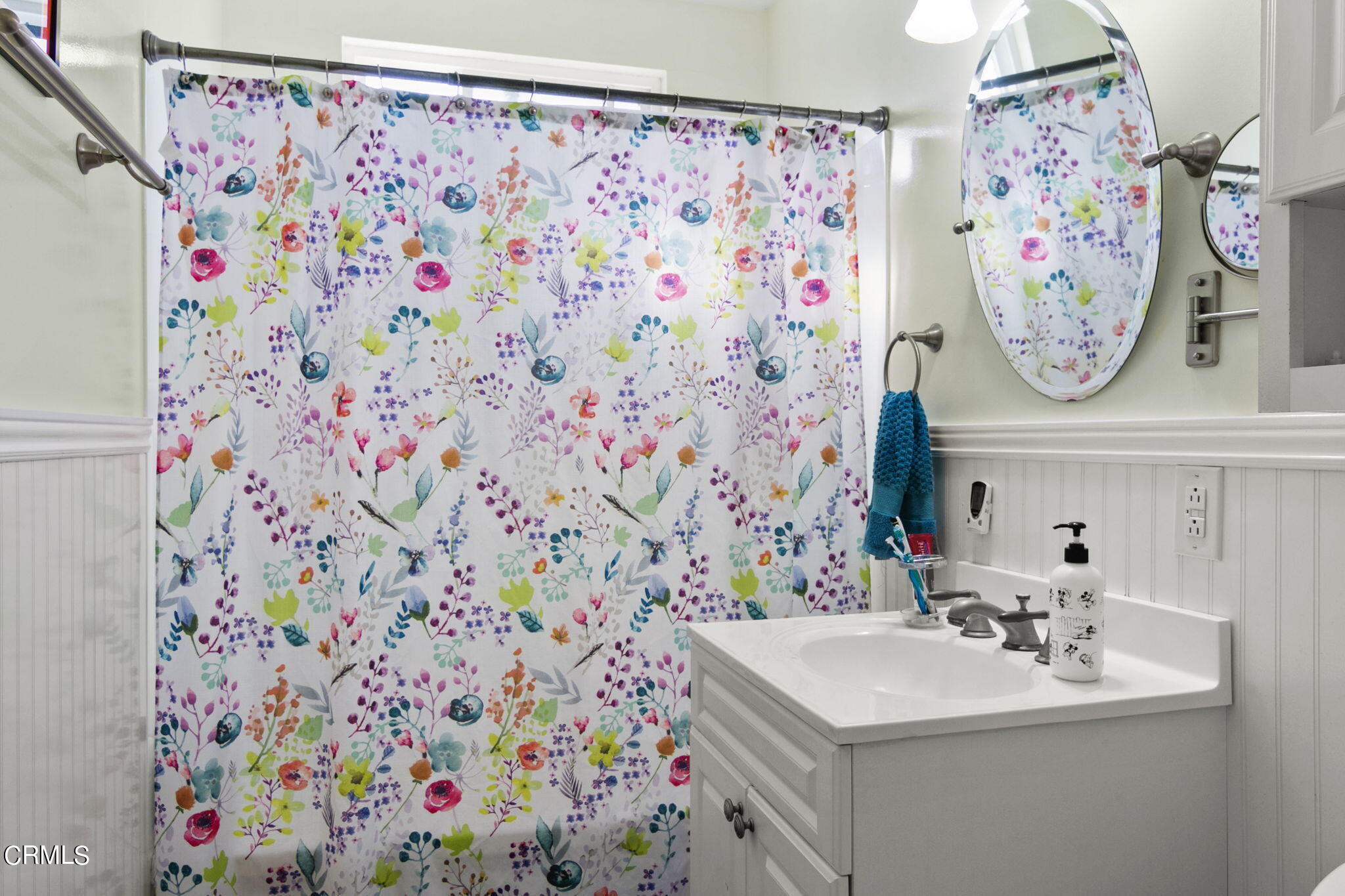 524 Nectarine Street Oxnard, CA 93033 - Photo 16 of 28 a bathroom with a sink and a mirror