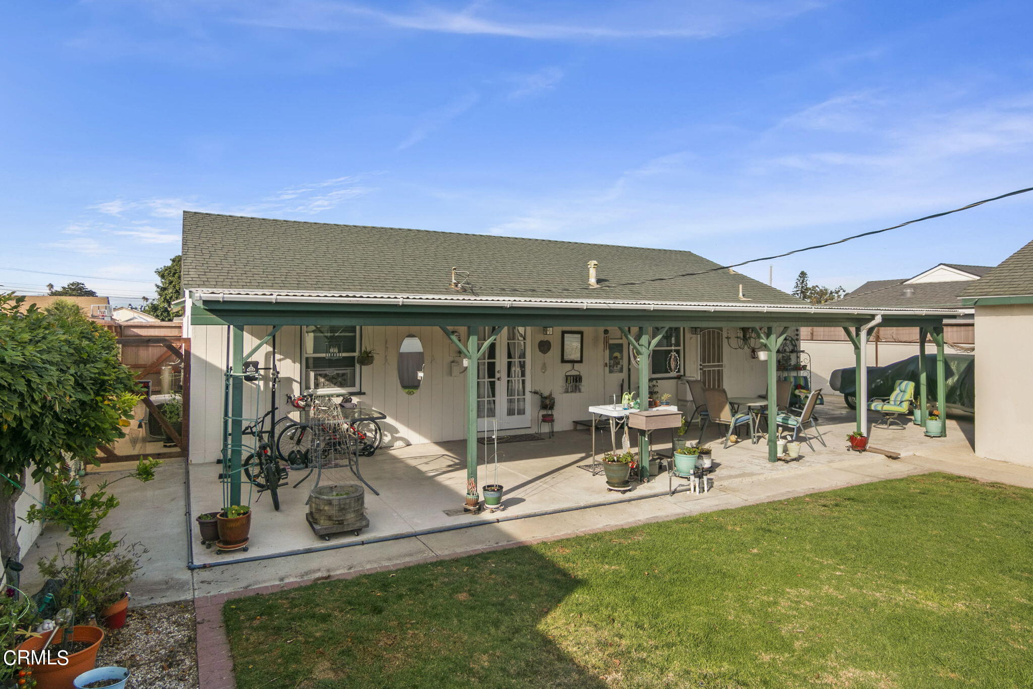 524 Nectarine Street Oxnard, CA 93033 - Photo 24 of 28 a view of a patio with table and chairs under an umbrella