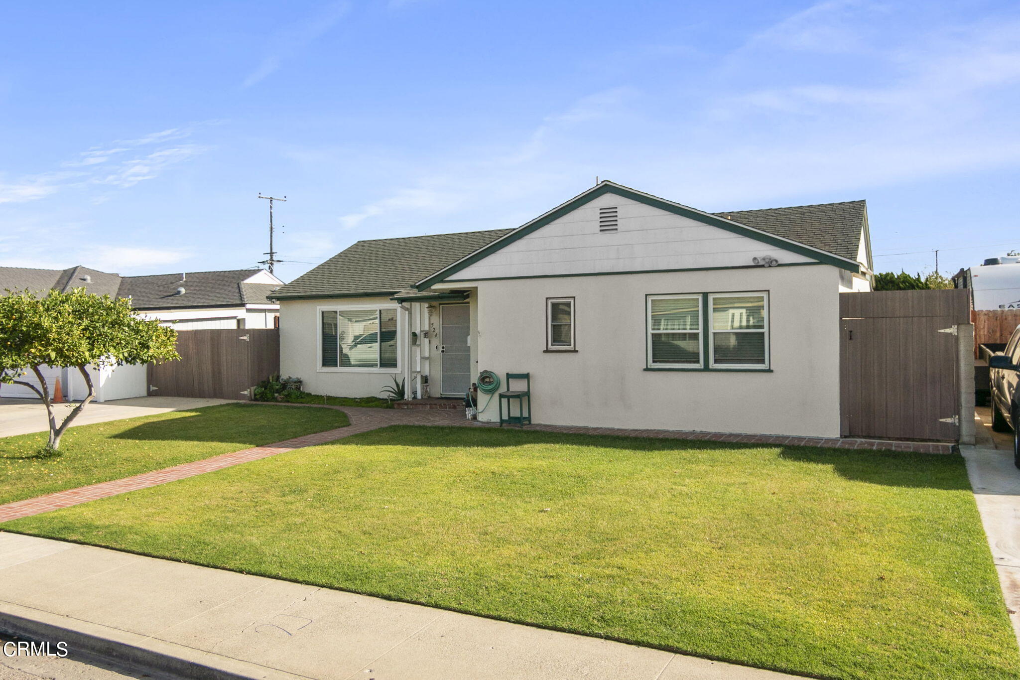 524 Nectarine Street Oxnard, CA 93033 - Photo 3 of 28 a front view of a house with a yard