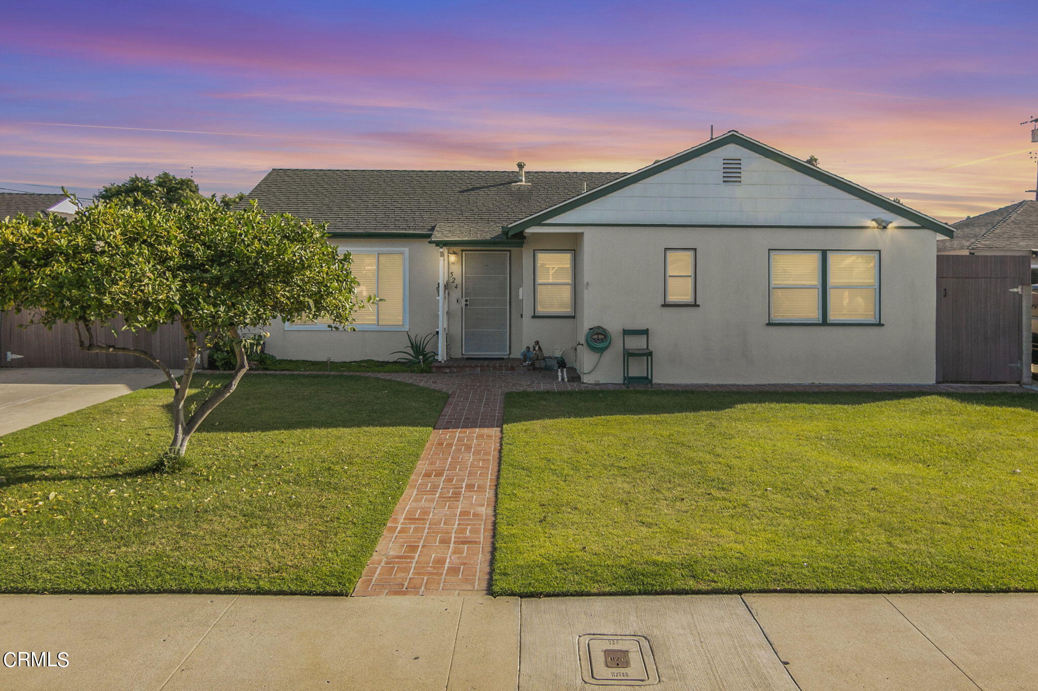 524 Nectarine Street Oxnard, CA 93033 - Photo 4 of 28 a front view of a house with a yard