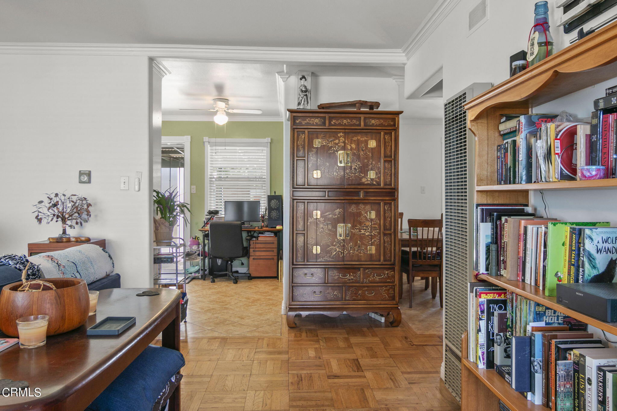 524 Nectarine Street Oxnard, CA 93033 - Photo 6 of 28 a living room with lots of furniture and a book shelf