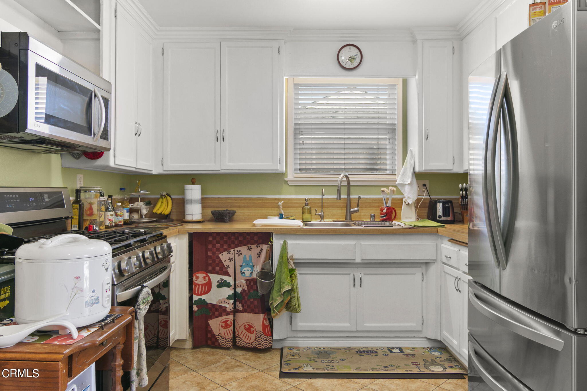 524 Nectarine Street Oxnard, CA 93033 - Photo 9 of 28 a kitchen with stainless steel appliances granite countertop a refrigerator stove and sink