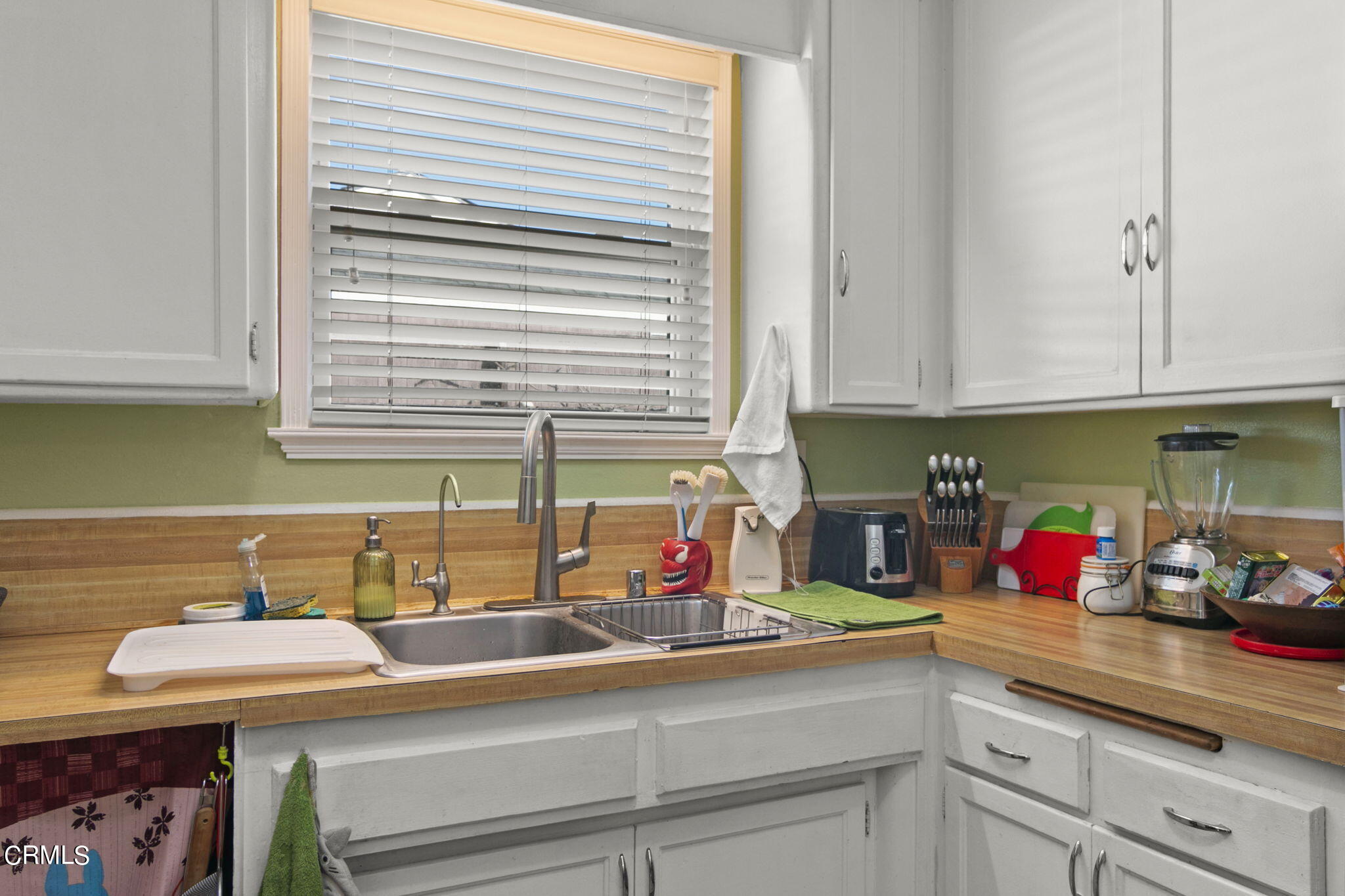 524 Nectarine Street Oxnard, CA 93033 - Photo 10 of 28 a kitchen with stainless steel appliances sink and cabinets