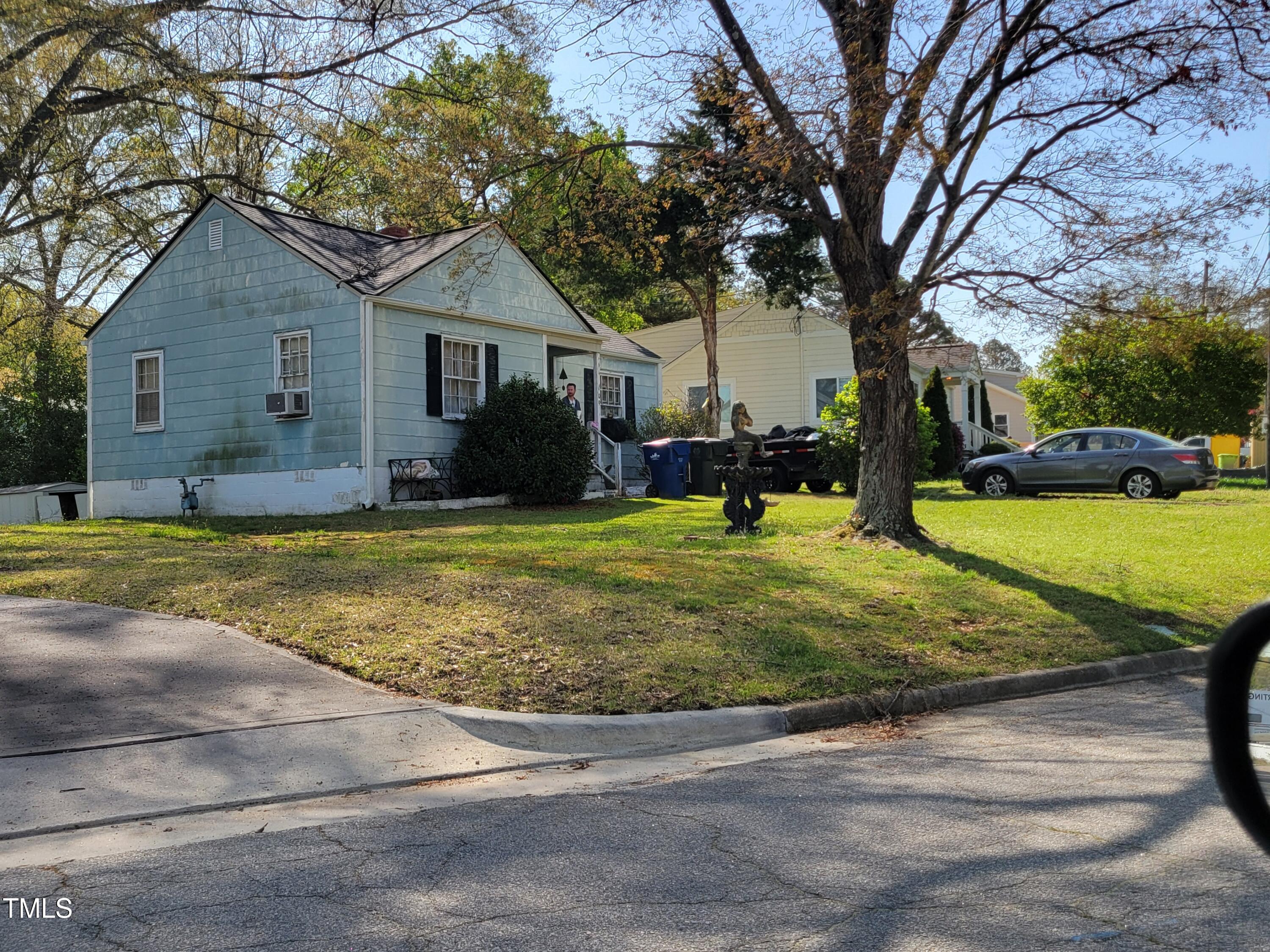 109 Plainview Avenue Raleigh, NC 27604 - Photo 2 of 4 a view of a house with a yard