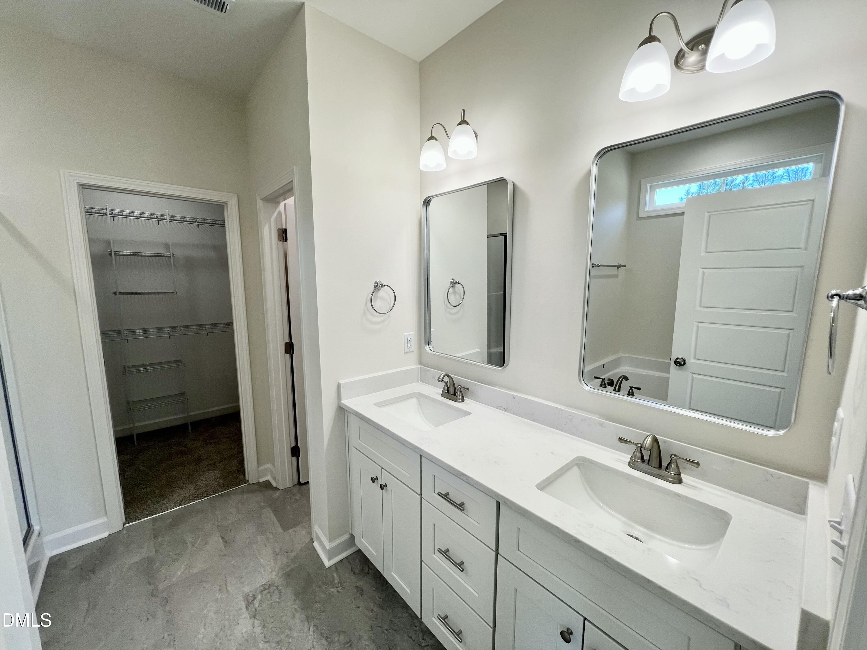 731 Polly Watson Road Fremont, NC 27830 - Photo 10 of 21 a bathroom with a double vanity sink mirror and double
