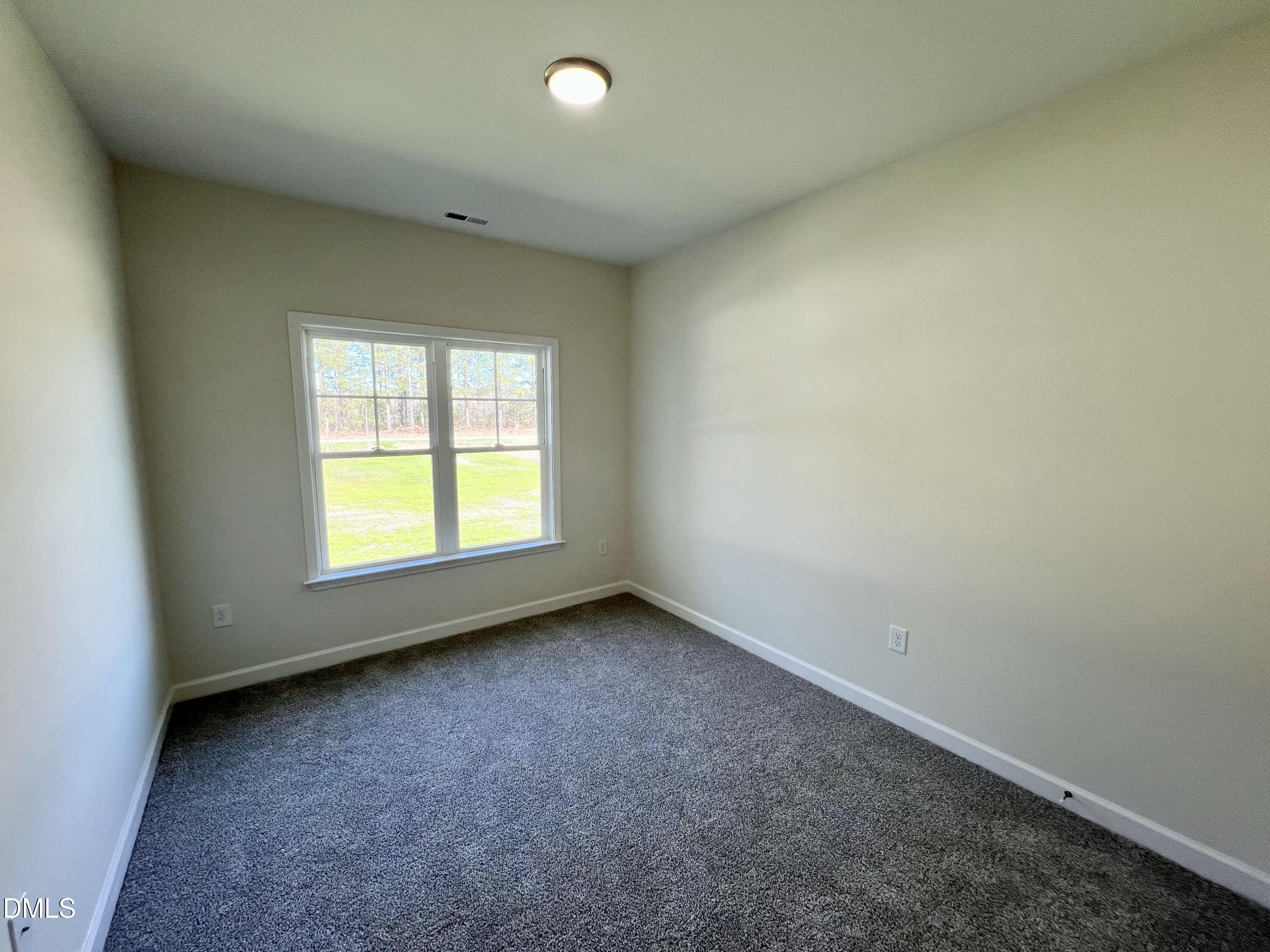 731 Polly Watson Road Fremont, NC 27830 - Photo 11 of 21 an empty room with a window