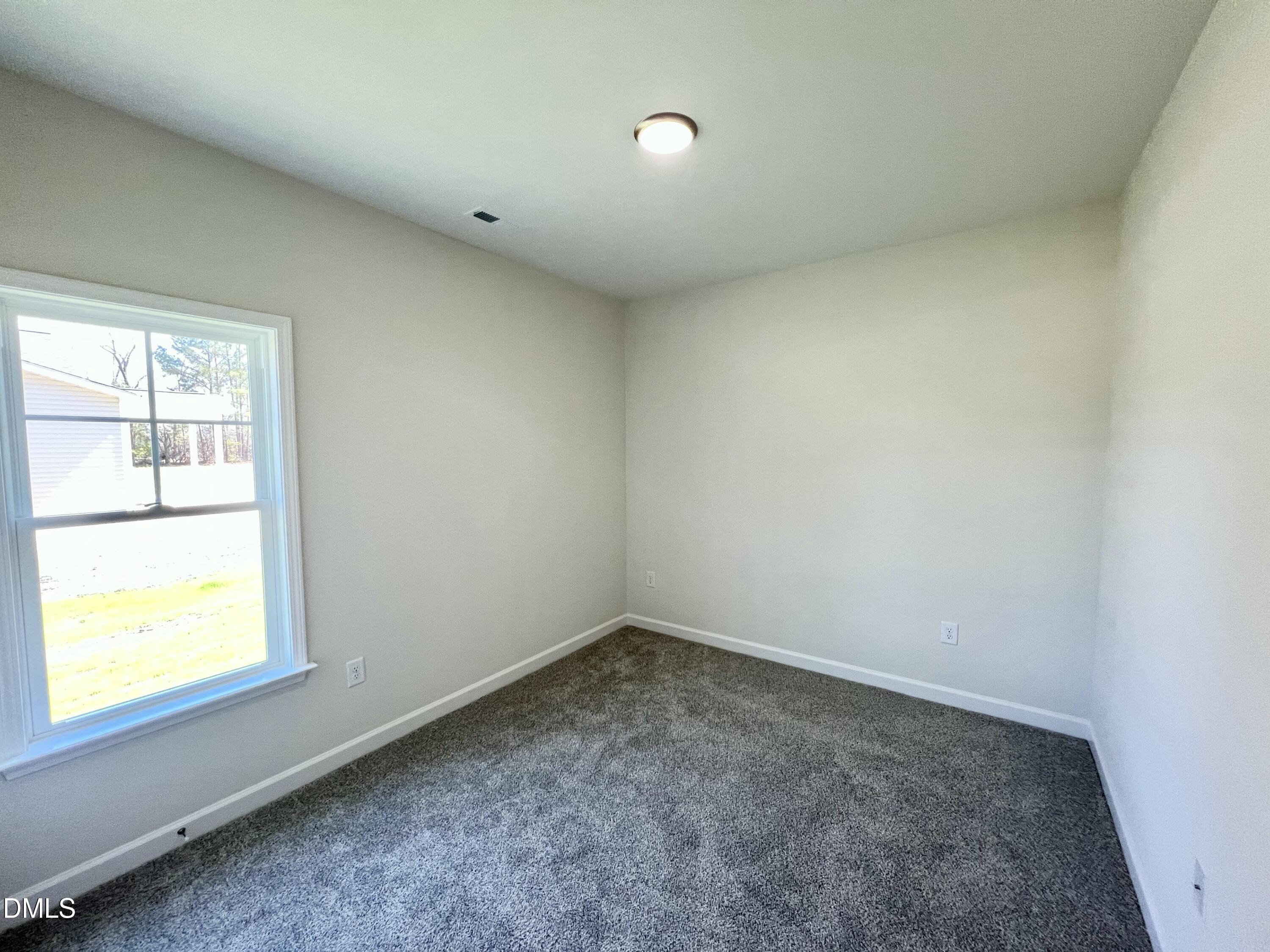 731 Polly Watson Road Fremont, NC 27830 - Photo 13 of 21 an empty room with a window