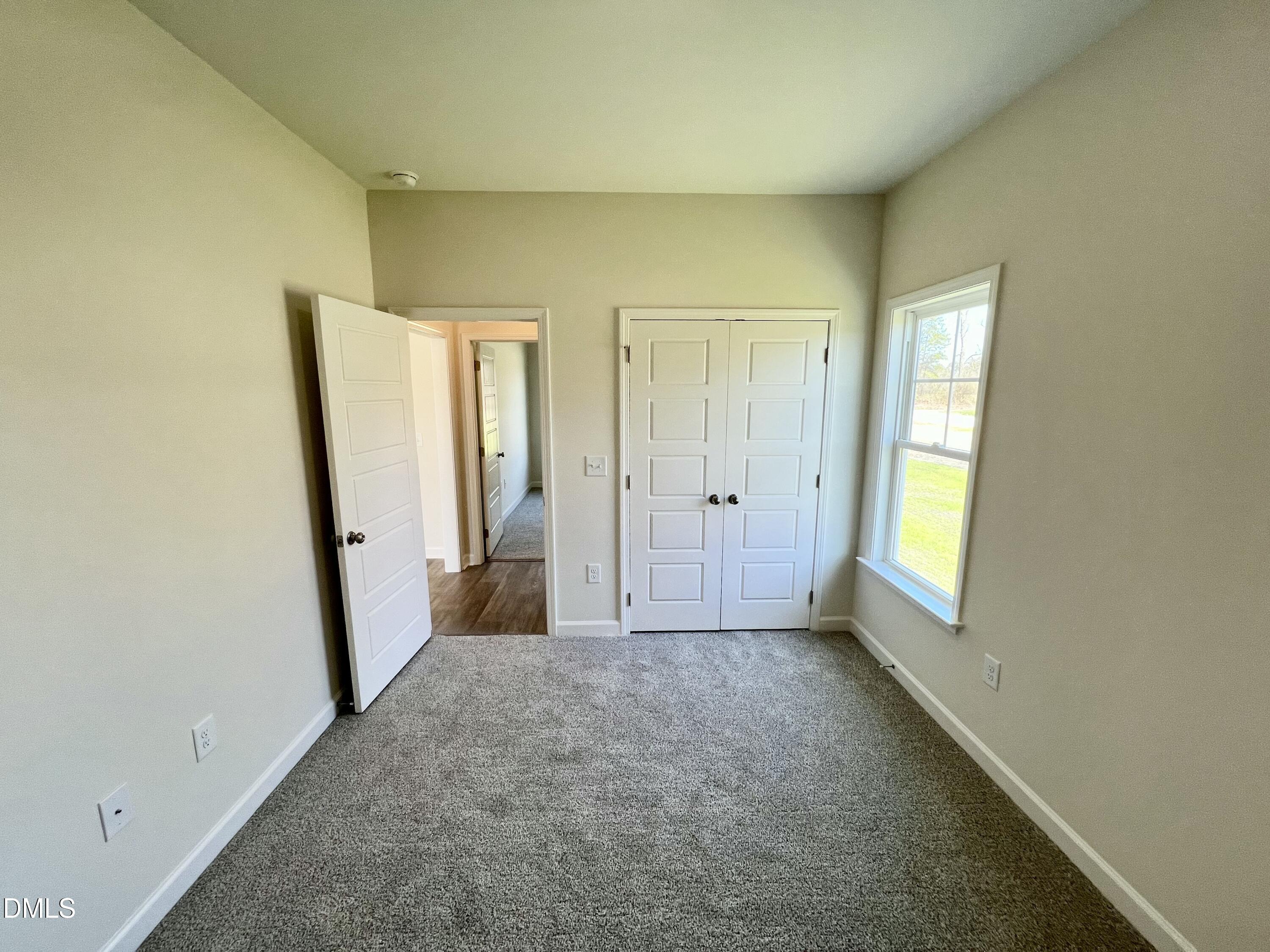731 Polly Watson Road Fremont, NC 27830 - Photo 14 of 21 an empty room with windows and closet