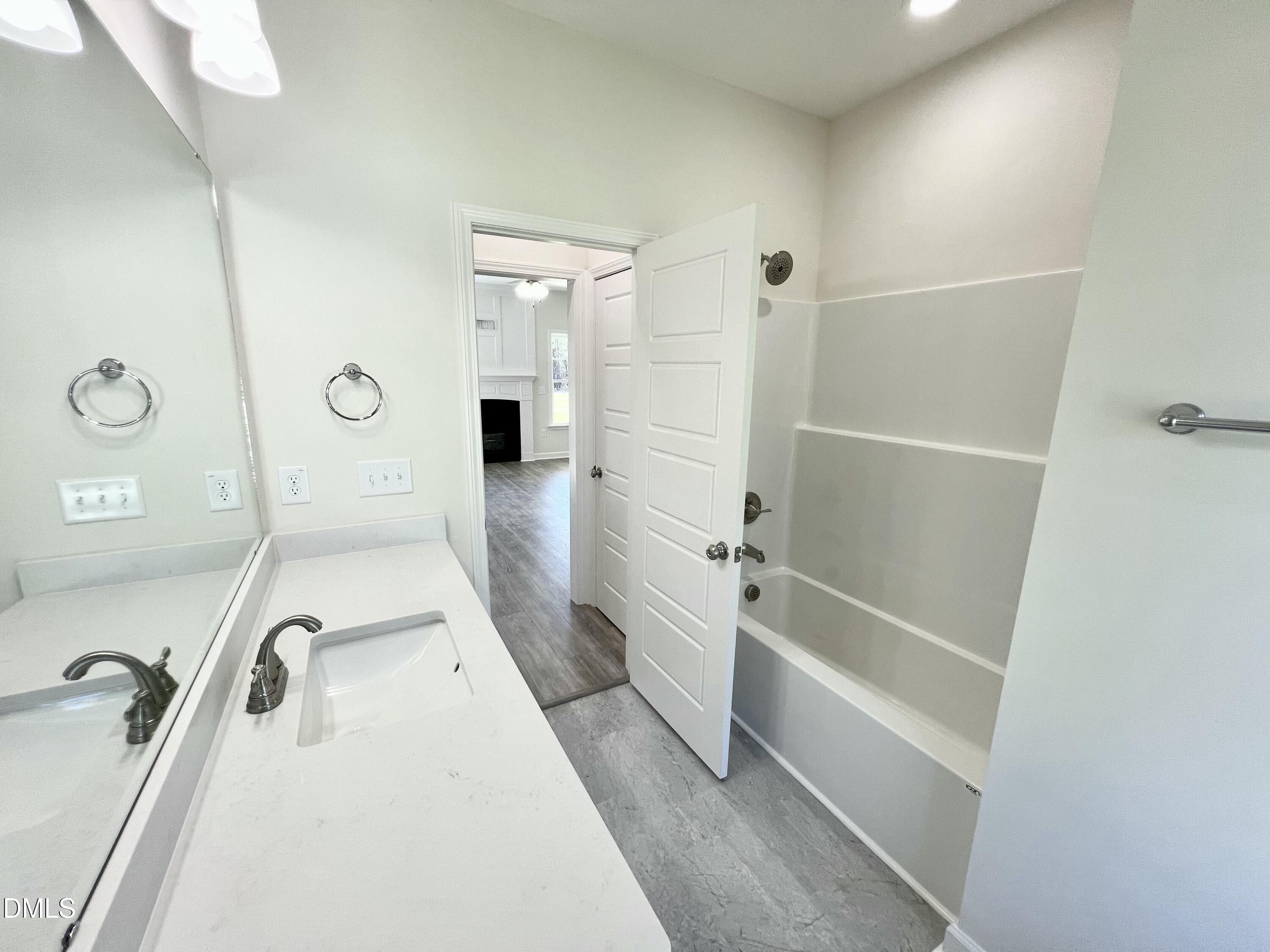 731 Polly Watson Road Fremont, NC 27830 - Photo 17 of 21 a bathroom with a tub sink and mirror