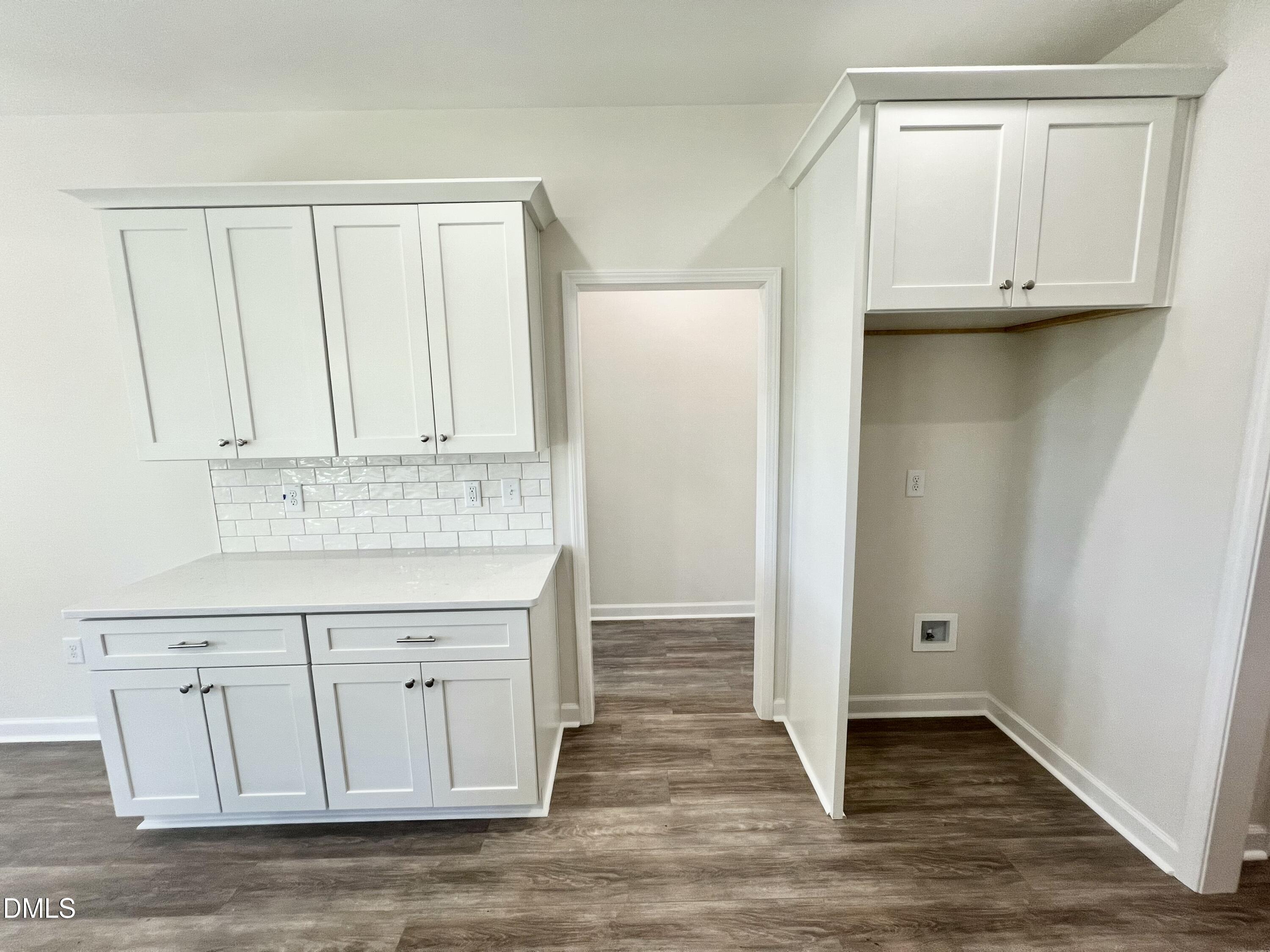 731 Polly Watson Road Fremont, NC 27830 - Photo 7 of 21 a view of cabinets with wooden floor