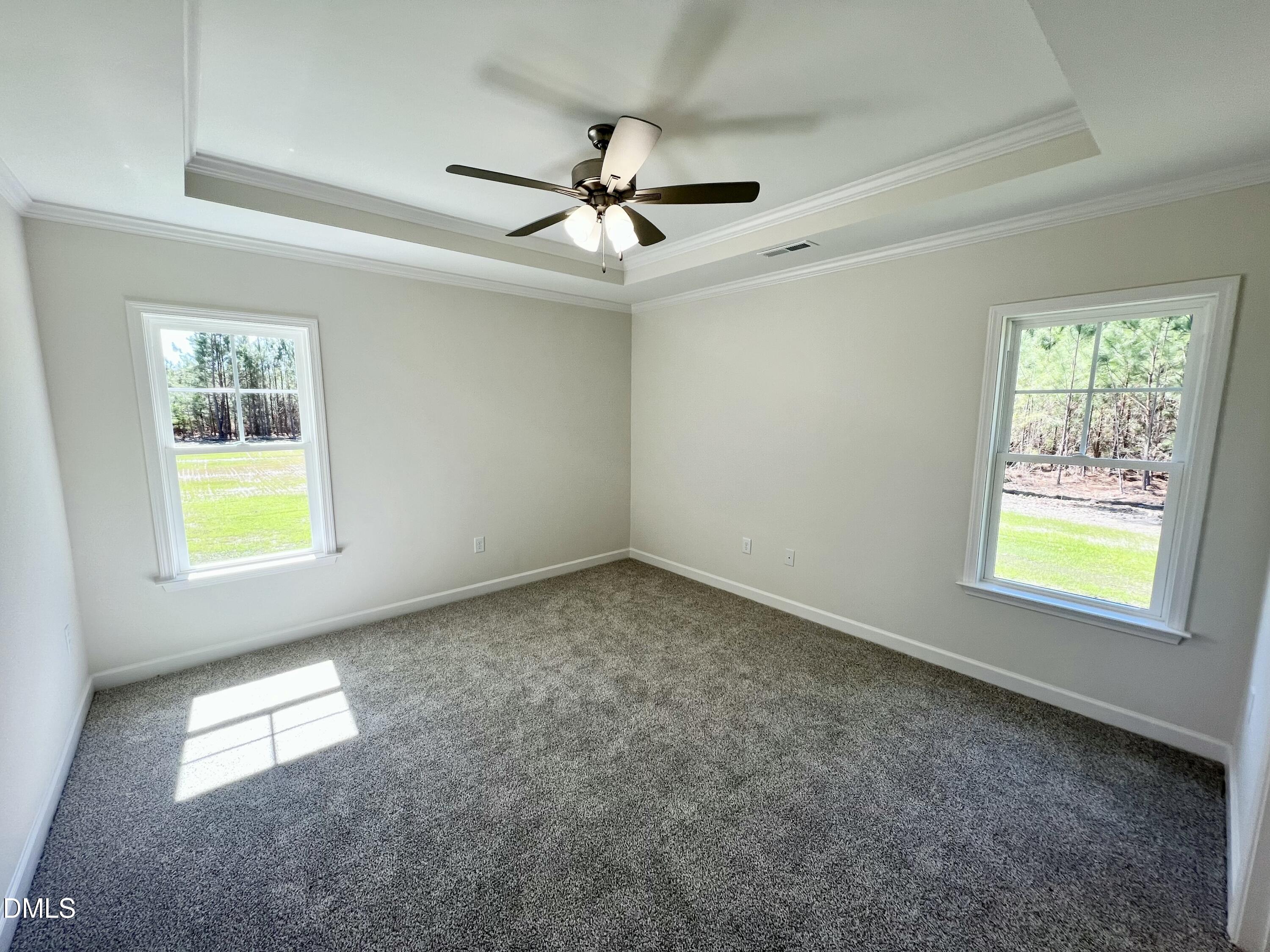 731 Polly Watson Road Fremont, NC 27830 - Photo 8 of 21 an empty room with windows and fan