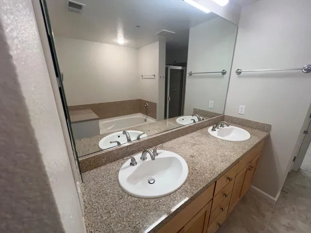 a bathroom with a sink a mirror and a sink