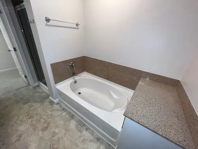 a bath tub sitting in a bathroom