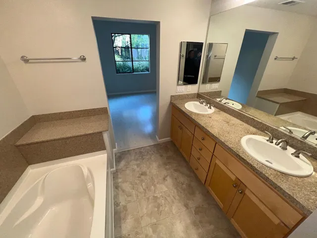 a bathroom with a sink and mirror