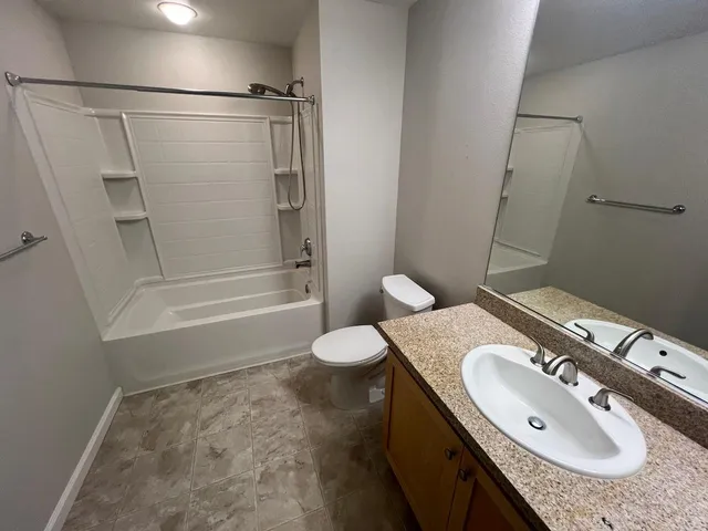a bathroom with a shower and a bath tub